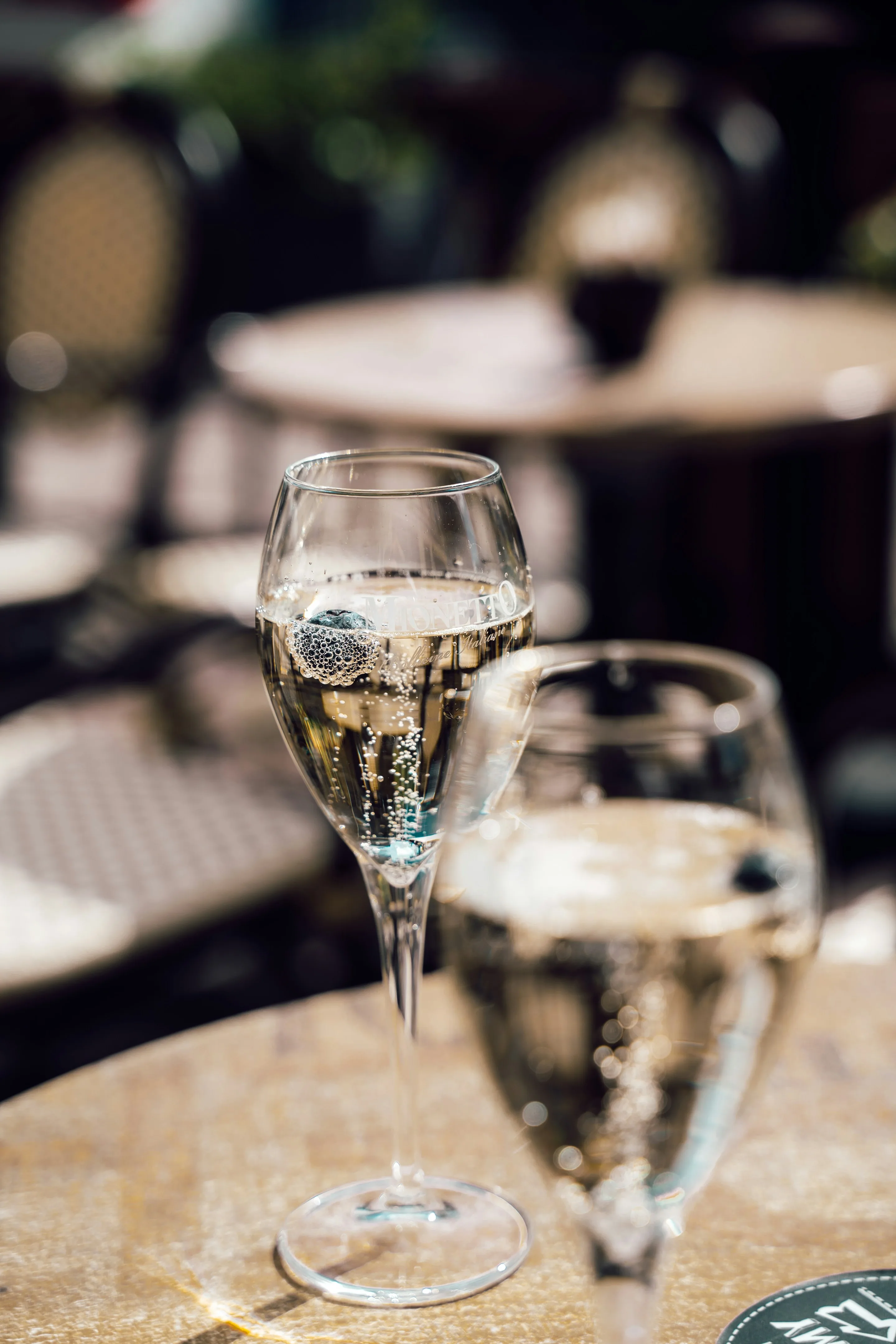 Two glasses of Cap Classique on a table